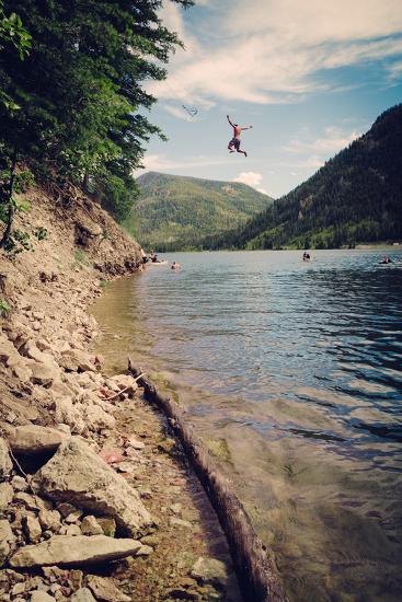 A Man Swings From A Rope Swing Into A Lake At Smith And Morehouse Reservoir Utah Photographic Print By Lindsay Daniels Art Com