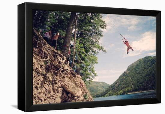 A Man Swings From A Rope Swing Into A Lake At Smith And Morehouse Reservoir, Utah-Lindsay Daniels-Framed Premier Image Canvas