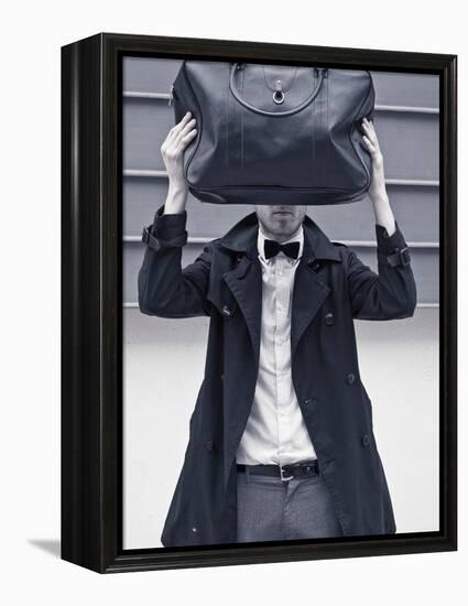 A Man Wearing a Bow Tie Hiding Behind a Bag-India Hobson-Framed Premier Image Canvas