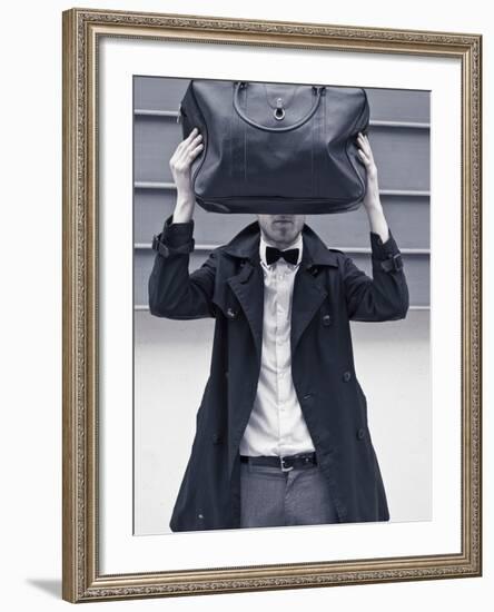 A Man Wearing a Bow Tie Hiding Behind a Bag-India Hobson-Framed Photographic Print