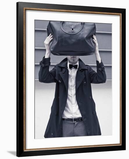 A Man Wearing a Bow Tie Hiding Behind a Bag-India Hobson-Framed Photographic Print