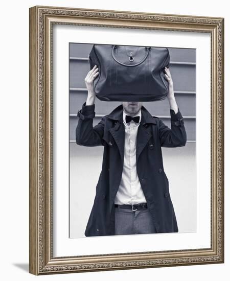 A Man Wearing a Bow Tie Hiding Behind a Bag-India Hobson-Framed Photographic Print