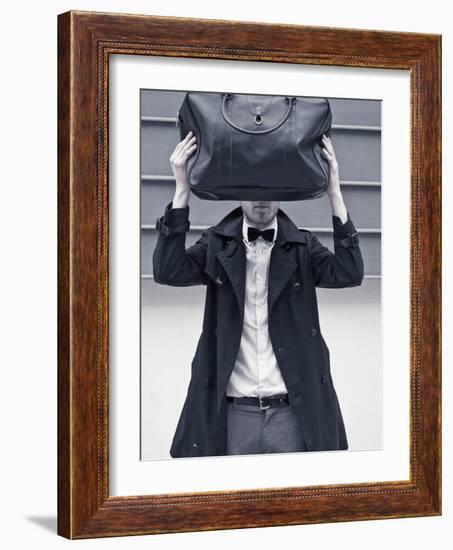 A Man Wearing a Bow Tie Hiding Behind a Bag-India Hobson-Framed Photographic Print