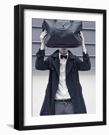 A Man Wearing a Bow Tie Hiding Behind a Bag-India Hobson-Framed Photographic Print