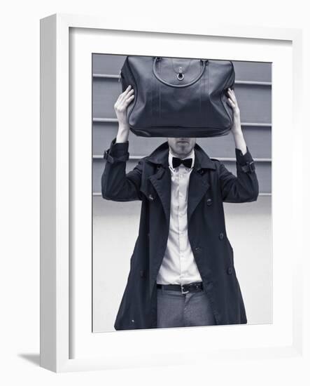 A Man Wearing a Bow Tie Hiding Behind a Bag-India Hobson-Framed Photographic Print