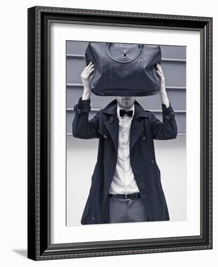 A Man Wearing a Bow Tie Hiding Behind a Bag-India Hobson-Framed Photographic Print