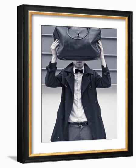 A Man Wearing a Bow Tie Hiding Behind a Bag-India Hobson-Framed Photographic Print