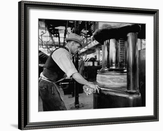 A Man Working in the Tire Facotry-William Vandivert-Framed Premium Photographic Print