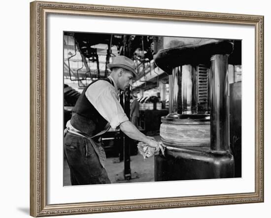 A Man Working in the Tire Facotry-William Vandivert-Framed Premium Photographic Print