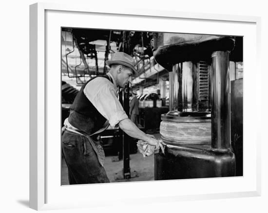 A Man Working in the Tire Facotry-William Vandivert-Framed Premium Photographic Print