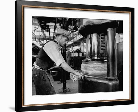 A Man Working in the Tire Facotry-William Vandivert-Framed Premium Photographic Print