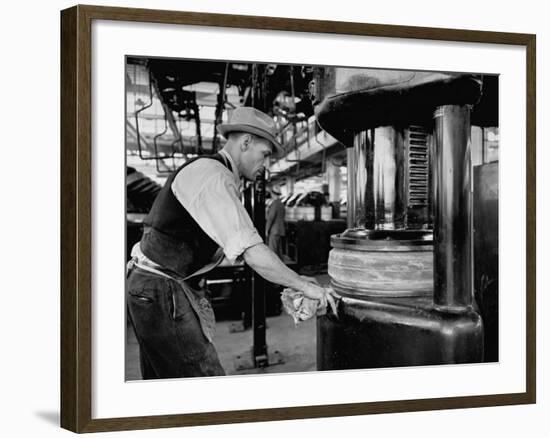 A Man Working in the Tire Facotry-William Vandivert-Framed Premium Photographic Print
