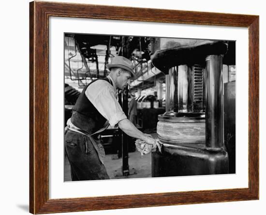 A Man Working in the Tire Facotry-William Vandivert-Framed Premium Photographic Print