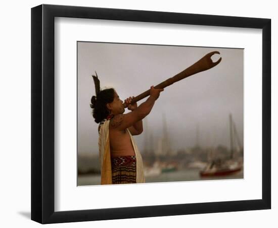 A Maori Warrior Calls Across Auckland-null-Framed Photographic Print