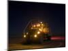 A Maxxpro MRAP Vehicle with Running Lights on at Night-null-Mounted Photographic Print