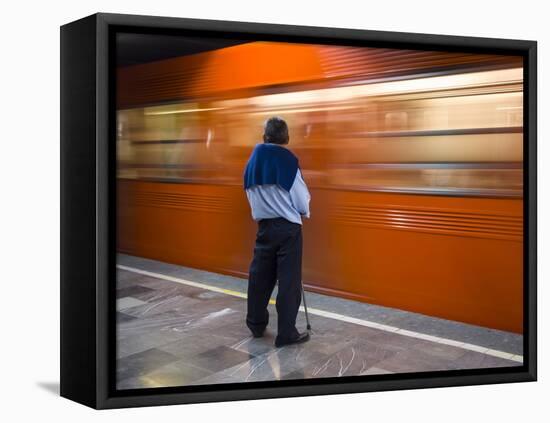 A Mexican Citizen Waits for the Metro to Stop, Mexico City, Mexico-Brent Bergherm-Framed Premier Image Canvas