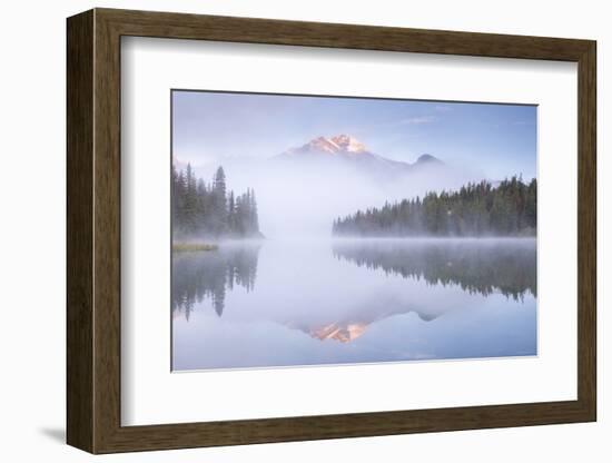 A mist shrouded Pyramid Mountain reflected in Pyramid Lake at dawn, Jasper National Park, Alberta, -Adam Burton-Framed Photographic Print