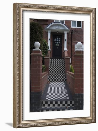 A Modern Black Front Door of a Residential House. With Black and White Stairs, and Pathway-Natalie Tepper-Framed Photo