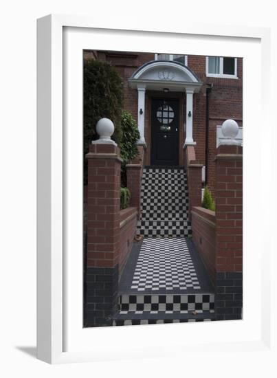 A Modern Black Front Door of a Residential House. With Black and White Stairs, and Pathway-Natalie Tepper-Framed Photo