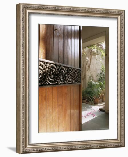 A Modern Front Door Decorated with a 400 Year Old Piece of Wood Carving-John Henry Claude Wilson-Framed Photographic Print