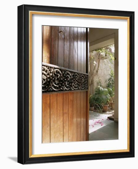 A Modern Front Door Decorated with a 400 Year Old Piece of Wood Carving-John Henry Claude Wilson-Framed Photographic Print