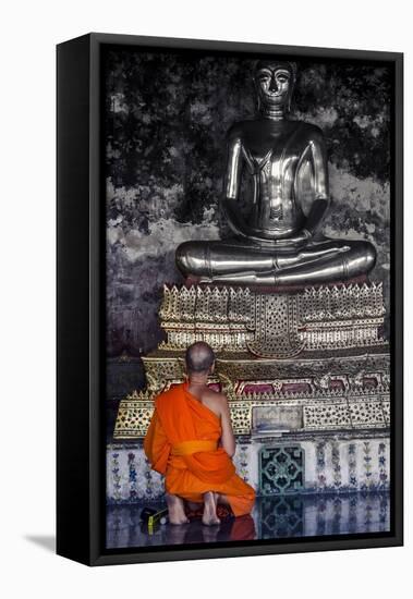 A Monk Prays in Front of a Golden Buddha, Wat Suthat, Bangkok, Thailand, Southeast Asia, Asia-Andrew Taylor-Framed Premier Image Canvas