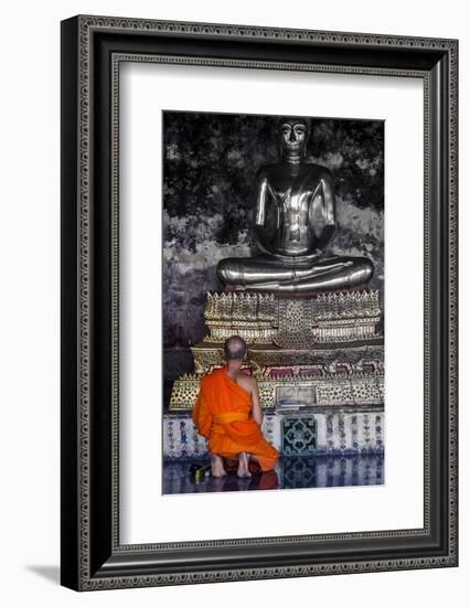 A Monk Prays in Front of a Golden Buddha, Wat Suthat, Bangkok, Thailand, Southeast Asia, Asia-Andrew Taylor-Framed Photographic Print