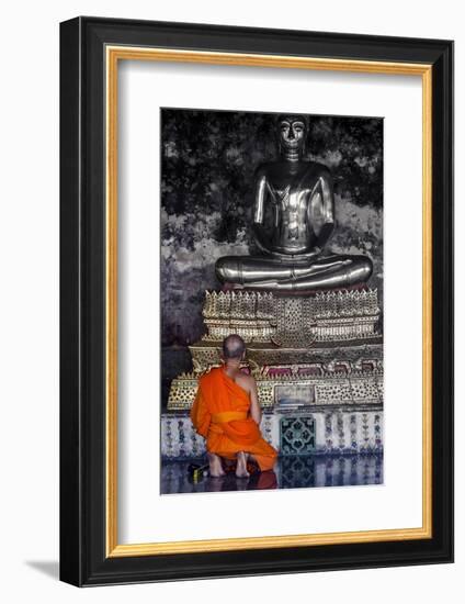 A Monk Prays in Front of a Golden Buddha, Wat Suthat, Bangkok, Thailand, Southeast Asia, Asia-Andrew Taylor-Framed Photographic Print