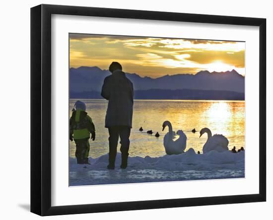 A Mother and Child Feed Water Fowl on the Ice Covered Shores of Lake Chiemsee-null-Framed Photographic Print