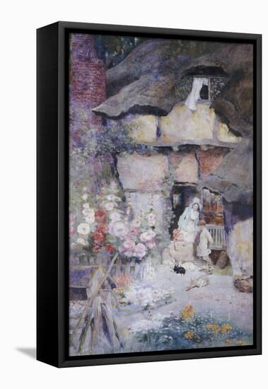 A Mother and Children Feeding Rabbits at the Door of a Thatched Cottage-David Woodlock-Framed Premier Image Canvas
