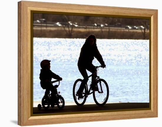 A Mother and Son are Silhouetted as They Ride Along the Schuylkill River-null-Framed Premier Image Canvas