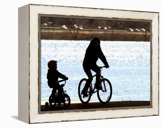 A Mother and Son are Silhouetted as They Ride Along the Schuylkill River-null-Framed Premier Image Canvas