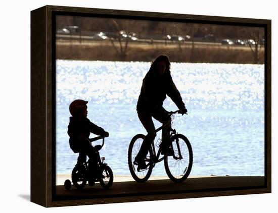 A Mother and Son are Silhouetted as They Ride Along the Schuylkill River-null-Framed Premier Image Canvas