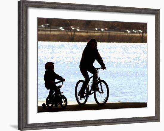 A Mother and Son are Silhouetted as They Ride Along the Schuylkill River-null-Framed Photographic Print