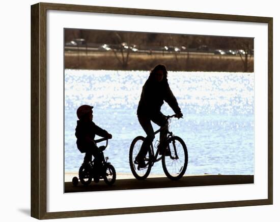 A Mother and Son are Silhouetted as They Ride Along the Schuylkill River-null-Framed Photographic Print