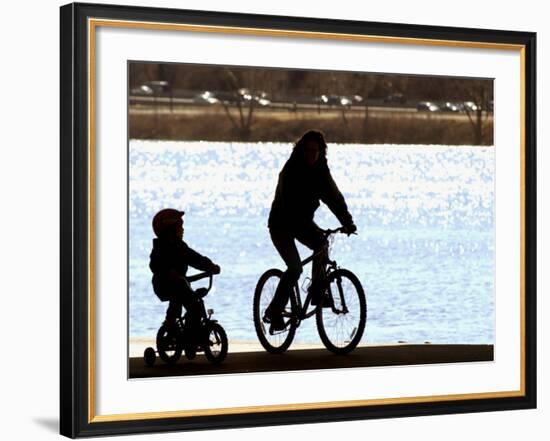 A Mother and Son are Silhouetted as They Ride Along the Schuylkill River-null-Framed Photographic Print