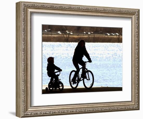 A Mother and Son are Silhouetted as They Ride Along the Schuylkill River-null-Framed Photographic Print