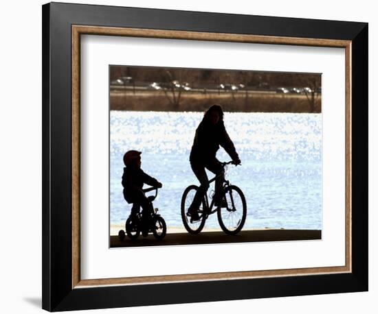 A Mother and Son are Silhouetted as They Ride Along the Schuylkill River-null-Framed Photographic Print