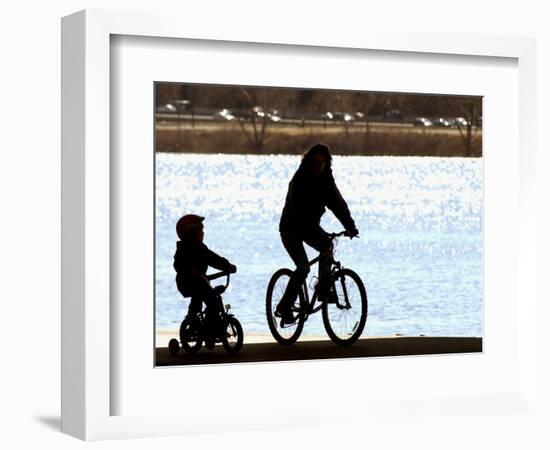 A Mother and Son are Silhouetted as They Ride Along the Schuylkill River-null-Framed Photographic Print