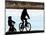 A Mother and Son are Silhouetted as They Ride Along the Schuylkill River-null-Mounted Photographic Print