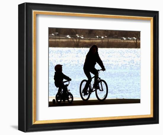 A Mother and Son are Silhouetted as They Ride Along the Schuylkill River-null-Framed Photographic Print