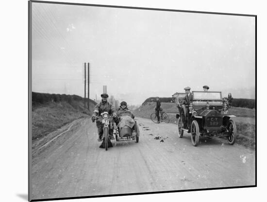 A Motorcycle and Sidecar Passing a Car and Cyclist on the Road-null-Mounted Photographic Print