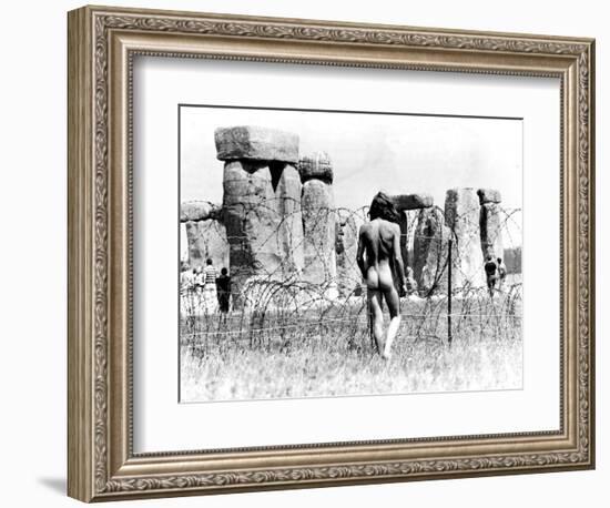 A Naked Hippy Watches Stonehenge from Behind Barb Wire on Summer Solstice-null-Framed Photographic Print