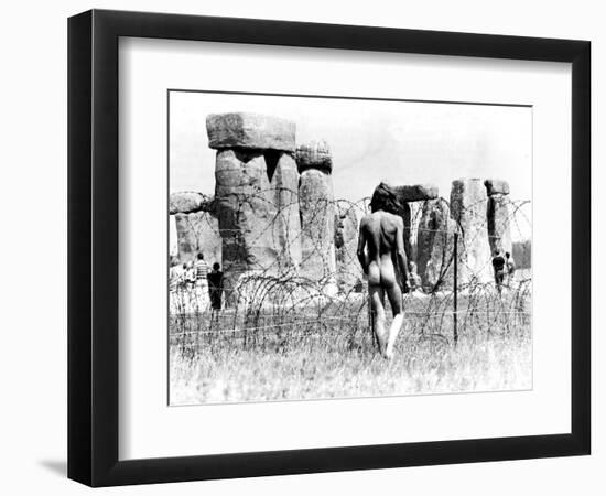 A Naked Hippy Watches Stonehenge from Behind Barb Wire on Summer Solstice-null-Framed Photographic Print