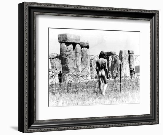 A Naked Hippy Watches Stonehenge from Behind Barb Wire on Summer Solstice-null-Framed Photographic Print