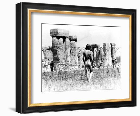 A Naked Hippy Watches Stonehenge from Behind Barb Wire on Summer Solstice-null-Framed Photographic Print