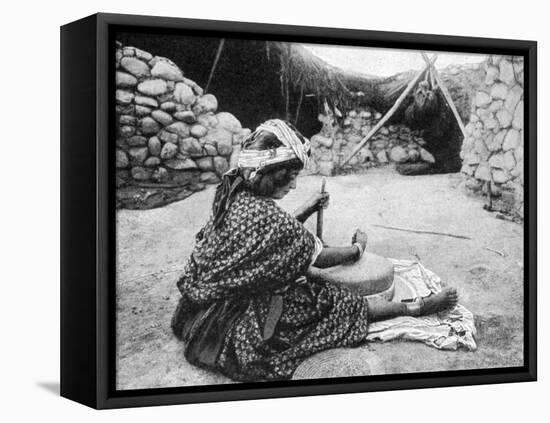 A Nomad Maid of the Mill Preparing Couscous, Algeria, 1922-A Bougaut-Framed Premier Image Canvas