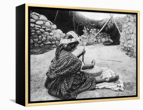 A Nomad Maid of the Mill Preparing Couscous, Algeria, 1922-A Bougaut-Framed Premier Image Canvas