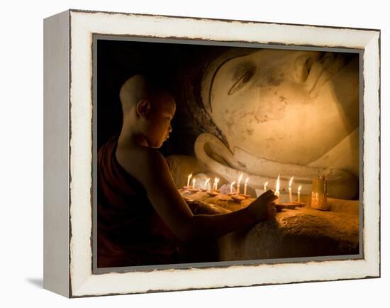 A Novice Monk Lighting Candles at a Massive Buddha Statue in Burma (Myanmar)-Kyle Hammons-Framed Premier Image Canvas