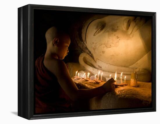 A Novice Monk Lighting Candles at a Massive Buddha Statue in Burma (Myanmar)-Kyle Hammons-Framed Premier Image Canvas
